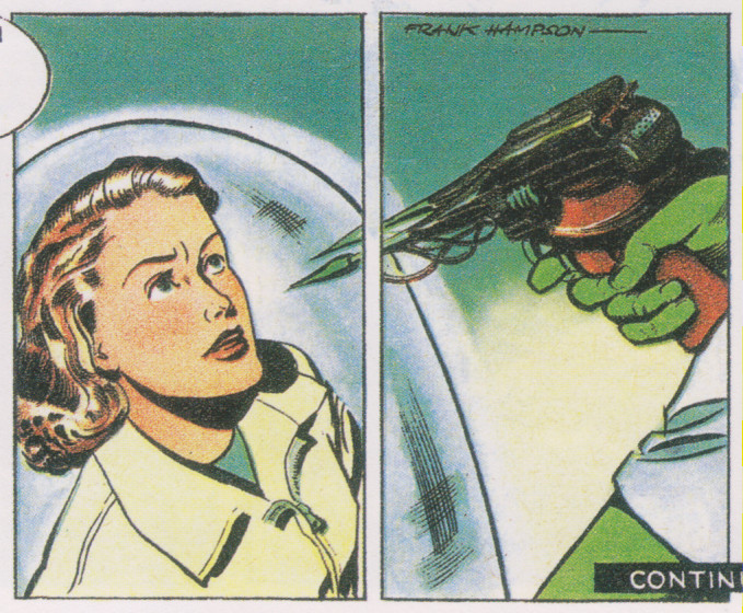 A young woman trapped in a sort of plastic bubble looks defiantly up at a gun-like device being held by a green hand.